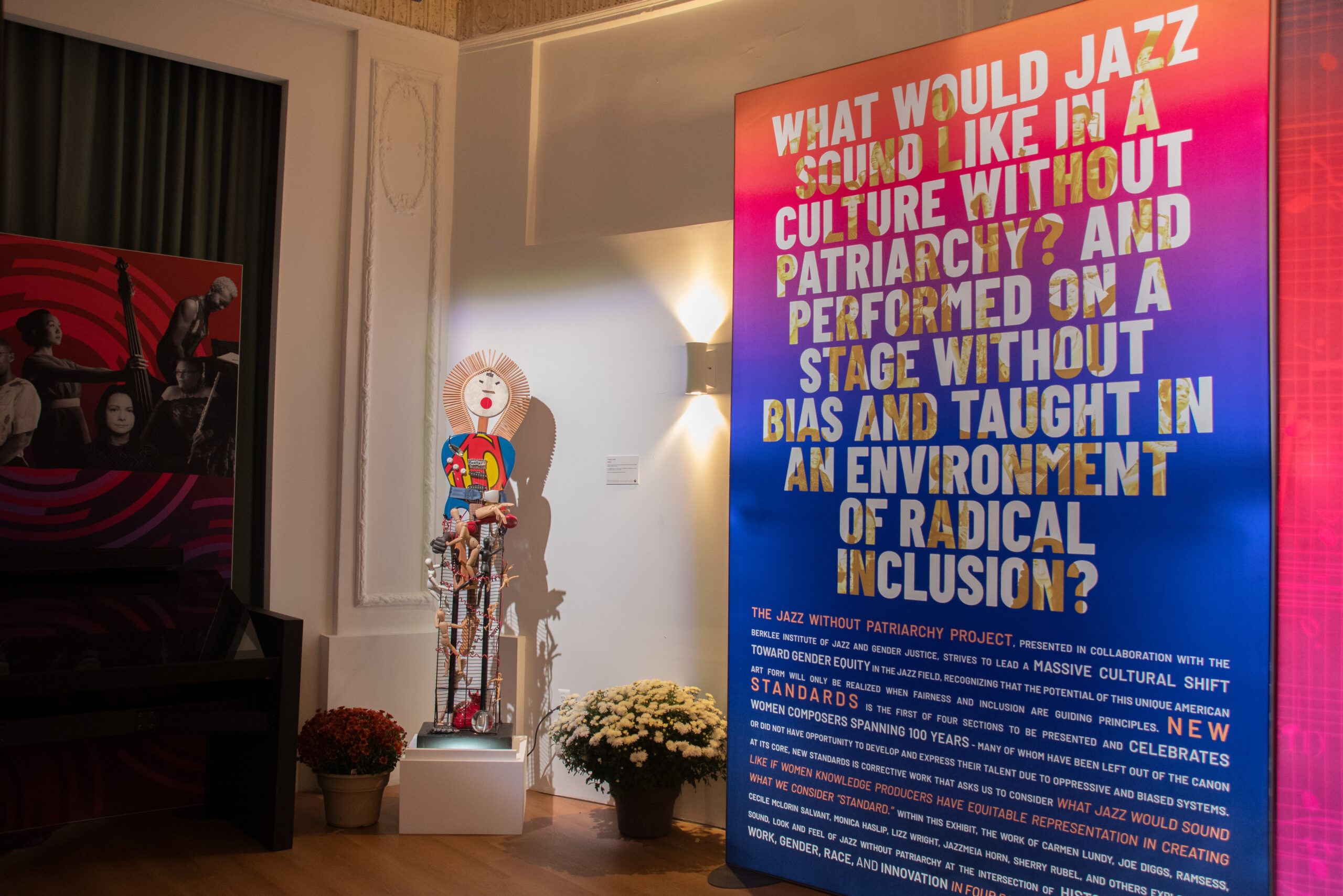 Exhibit entrance, including introductory text panel: “What would jazz sound like in a culture without patriarchy? And performed on a stage without bias and taught in an environment of radical inclusion”. Also includes sculpture by Carmen Lundy (“Shero”), and listening kiosk.
