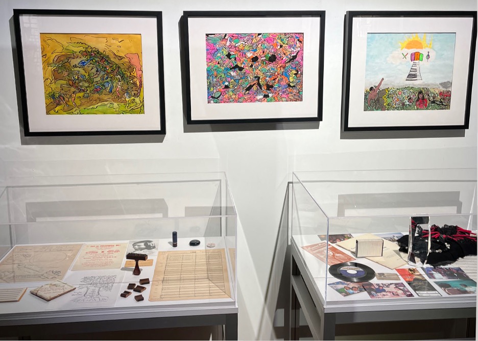 photo from exhibit, including three paintings by Mary Lou Williams, and artifacts from Mary Lou Williams and Geri Allen archive collections