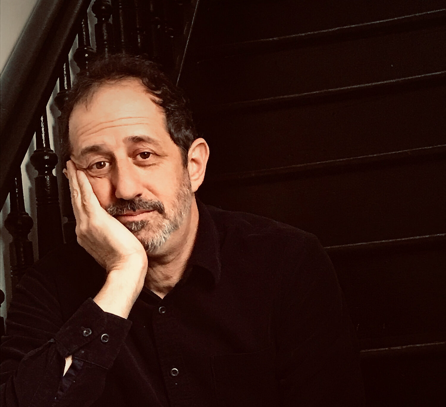 Ethan Lipton sitting on stairs