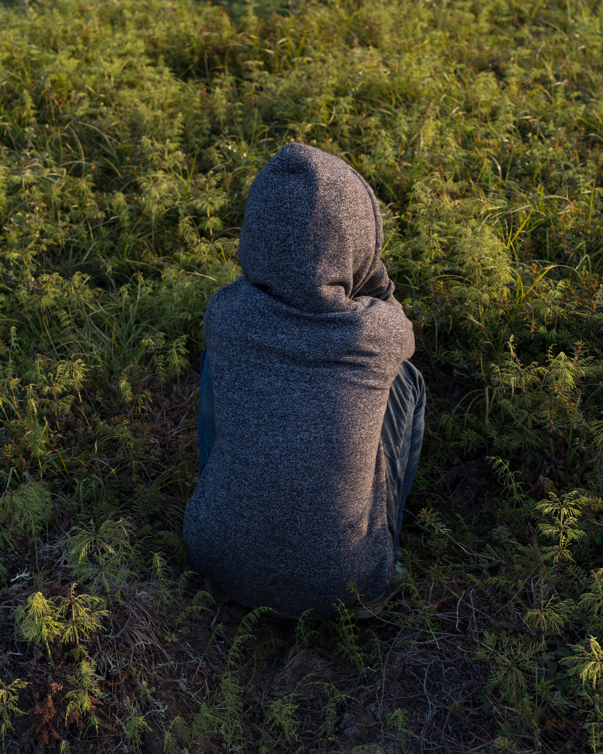 Jasmin Kassaiuli plays hide-and-seek in Mertarvik, Alaska on July 14, 2020.