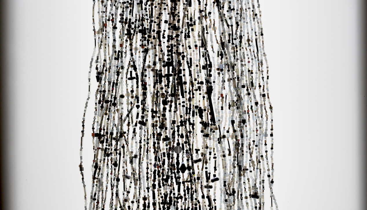 A silver, black, and white collection of beaded strings. Sarah Rosalena, Exit VAR!, 2022, © Sarah Rosalena, photo © Museum Associates/LACMA, photo credit: Ian Byars-Gamber