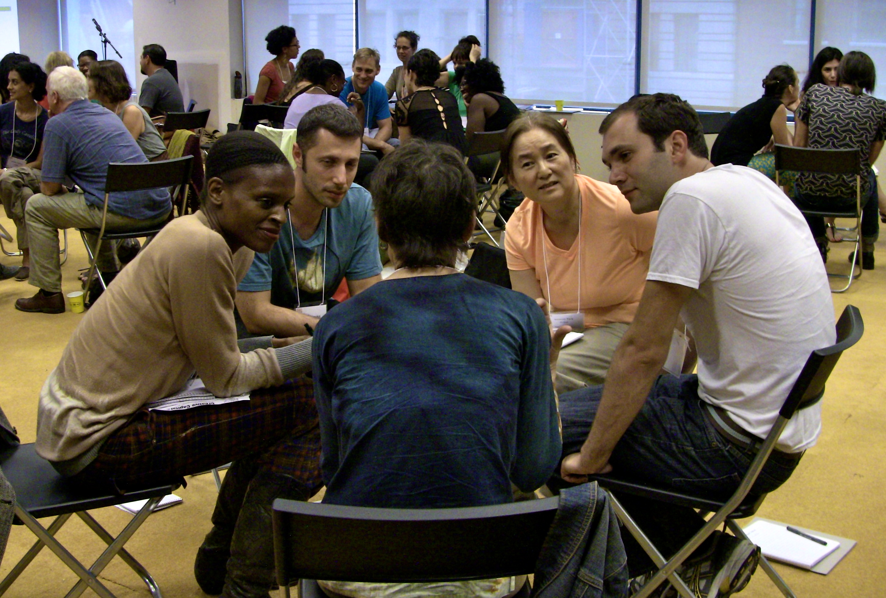 Artists chat in working groups at the 2013 Artists Summer Institute. 