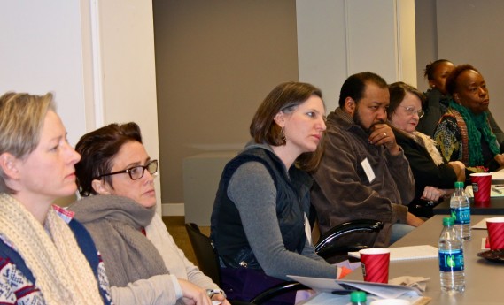 Participants listen intently at a Financial Literacy Workshop at 3Arts
