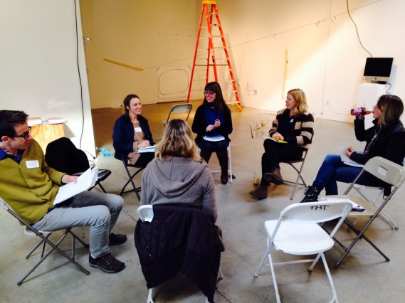 Artists break into smaller groups to discuss strategies to strengthen their careers