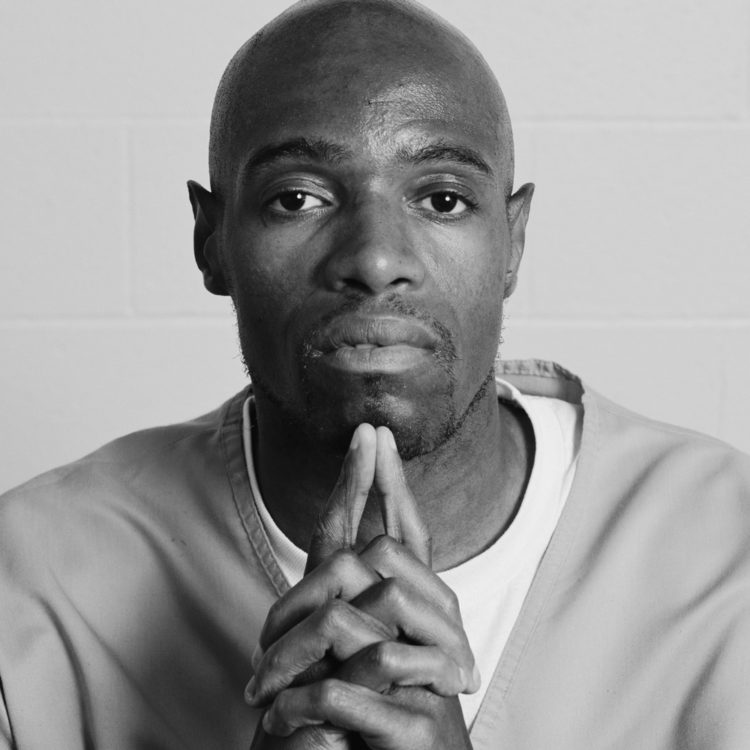a black and white image of an incarcerated individual, from Dread Scott's project LOCKDOWN