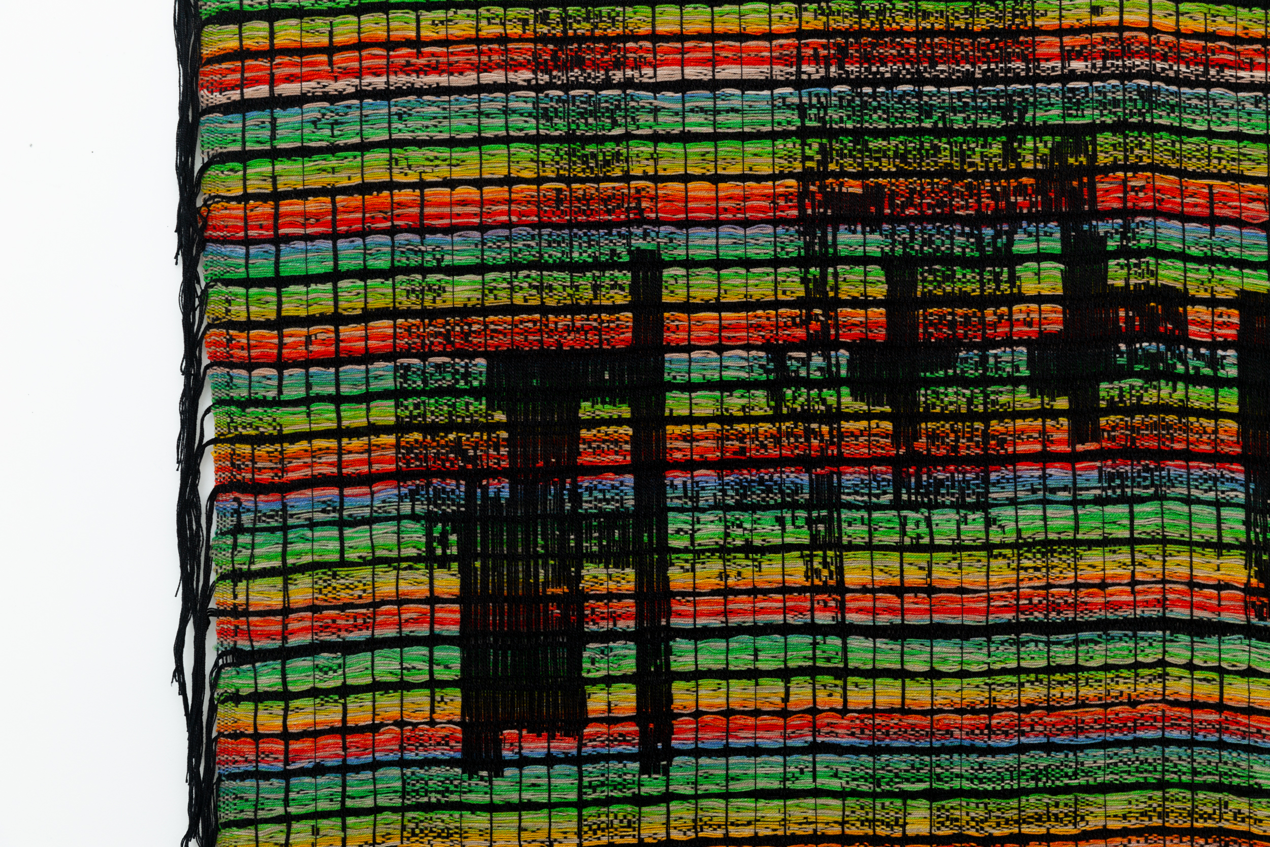 Detail of a colorful woven textile.