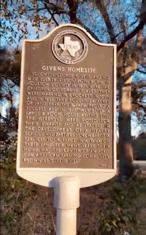 A brass sign in a white holder reads "GIVENS HOMESITE" and outlines the creation of a freedom town in Texas.