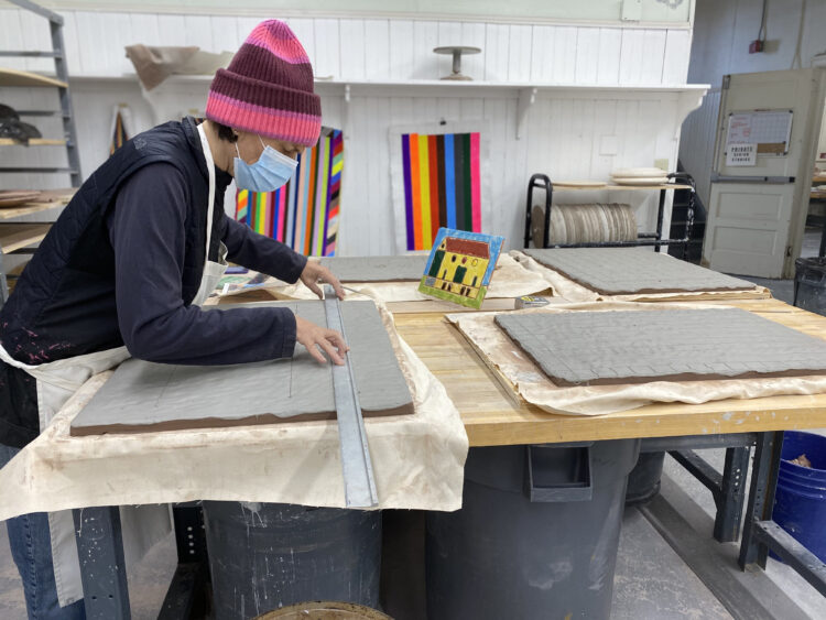 Polly Apfelbaum working in the ceramics studio at Arcadia University.